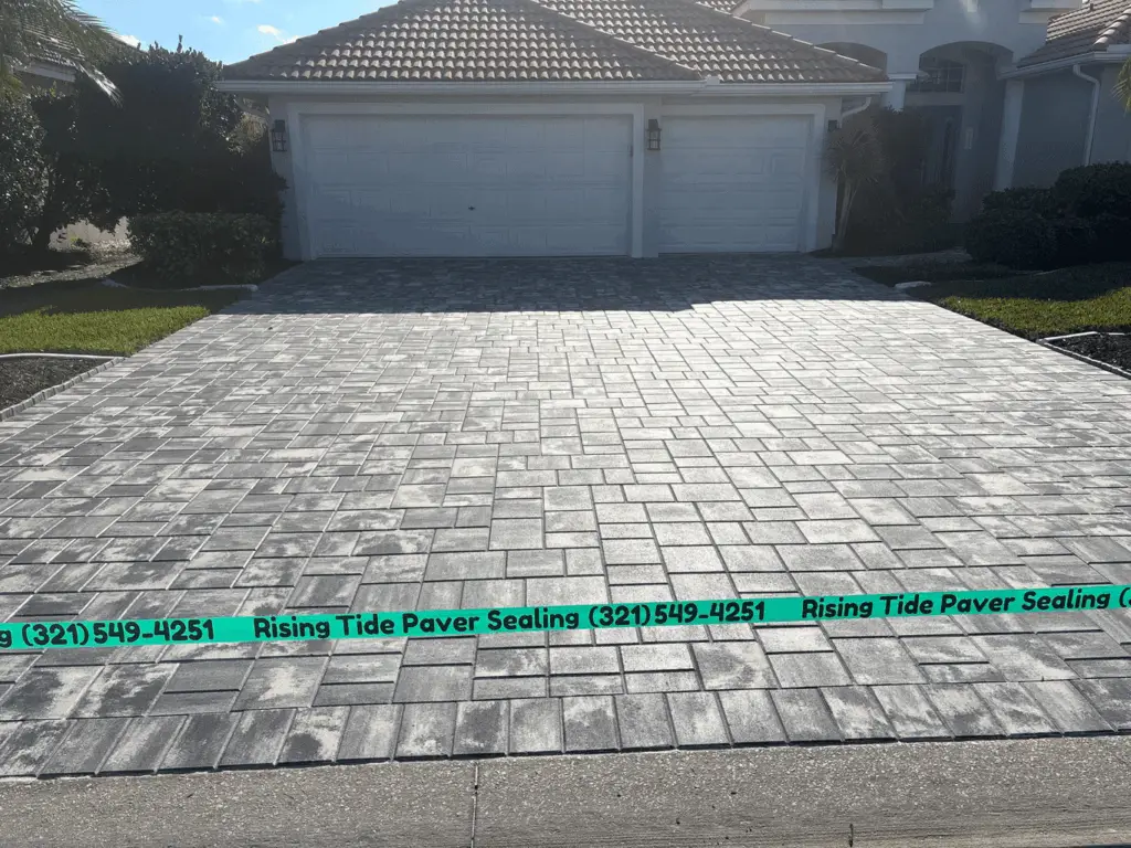 Perfectly sealed paver driveway. Gray and white sealed paver.